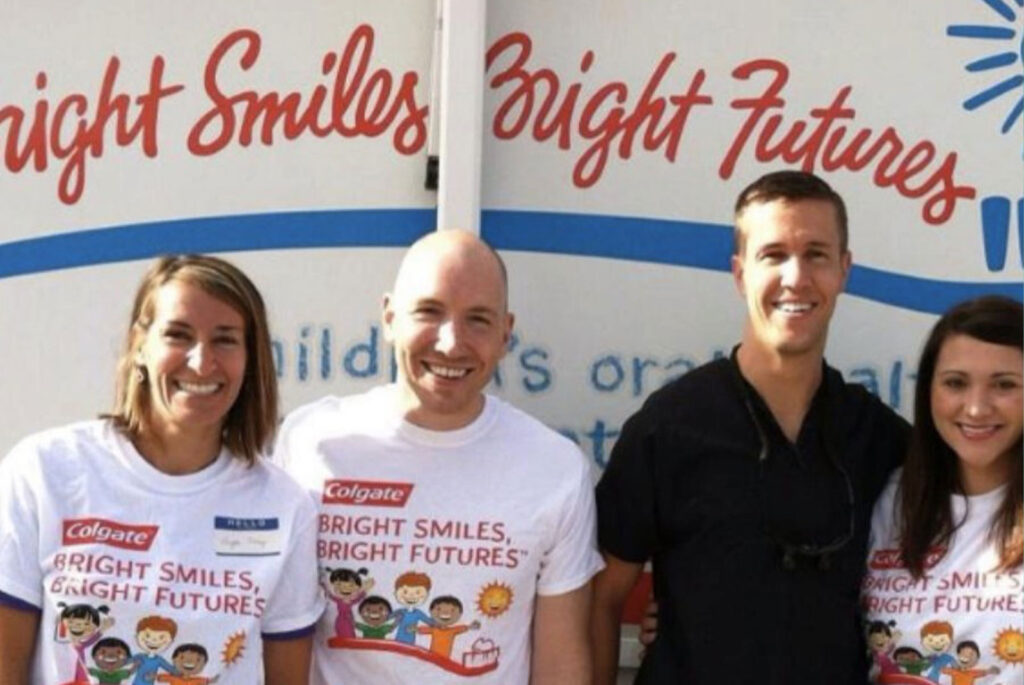 Group of staff members and doctor helping the surrounding communities