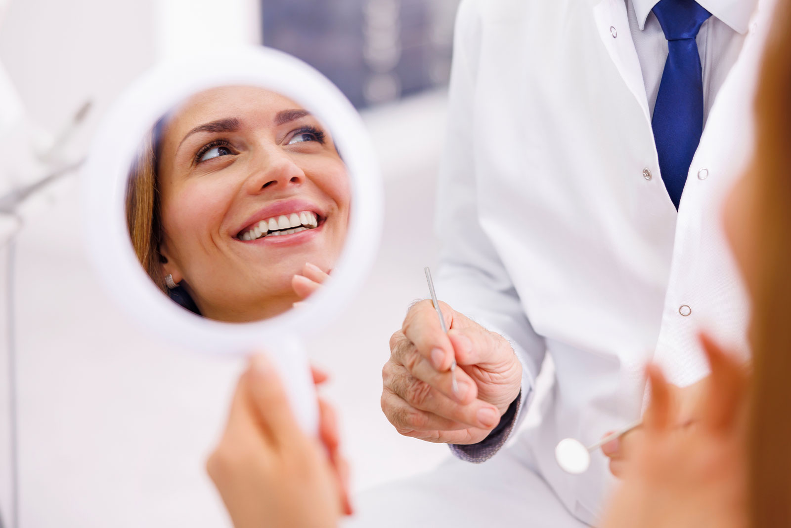 patient smiling brightly after their dental procedure information