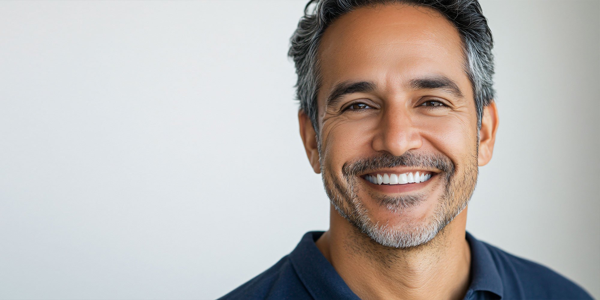 mature male patient smiling handomsly for their photoshoot